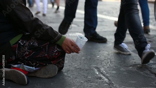 Woman homeless in city begging photo