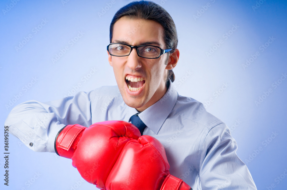 Businessman with boxing gloves Businessman with boxing gloves