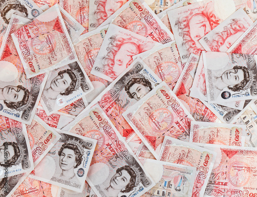 50 pound sterling bank notes closeup view business background photo