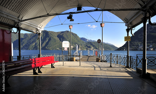 Pier of Lugano Lake in Switzerland photo