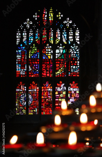 Candles and stained glass in the church