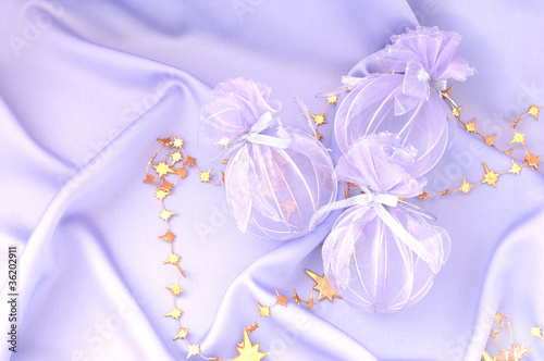 Light purple background with Christmas decorations © lusyaya