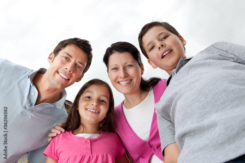 Portrait of beautiful young family together