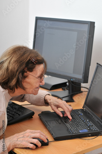 Never old enough - senior woman with computer photo