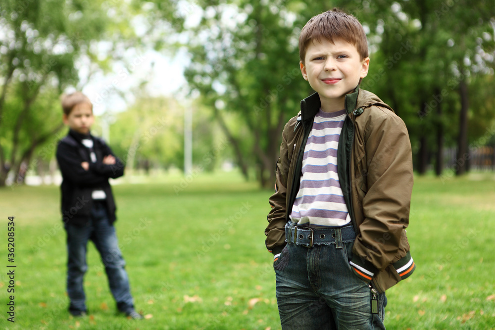 Boy with a friend in the green park Boy with a friend in the green park