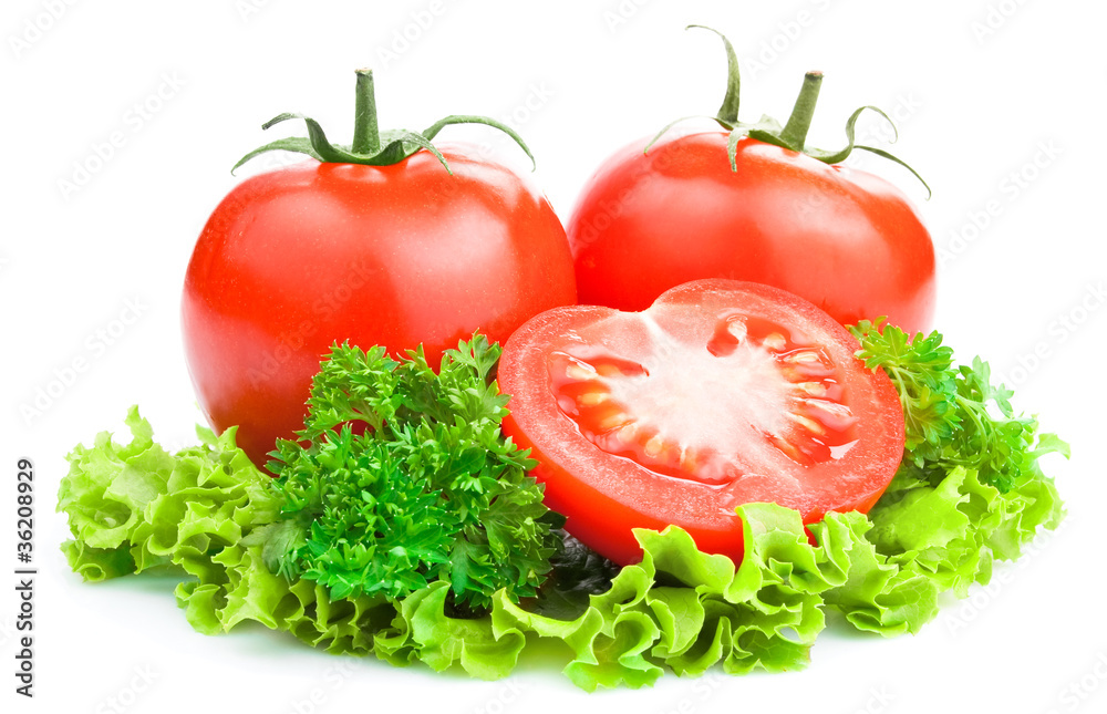 Red Ripe Tomatoes with cut and lettuce, parsley on White backgr Red Ripe Tomatoes with cut and lettuce, parsley on White backgr