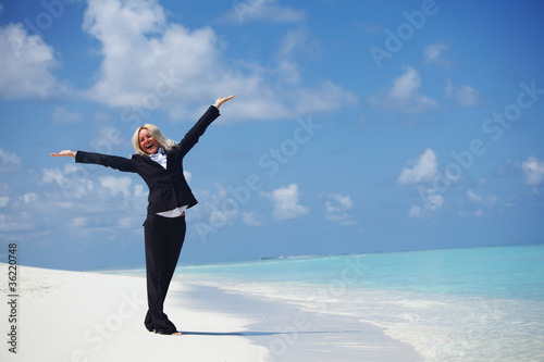 happy business woman on the ocean coast