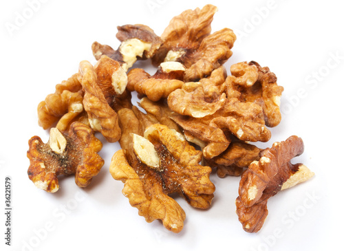 Crushed walnuts on white background