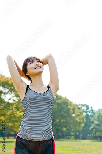 beautiful asian woman exercising in the park © taka