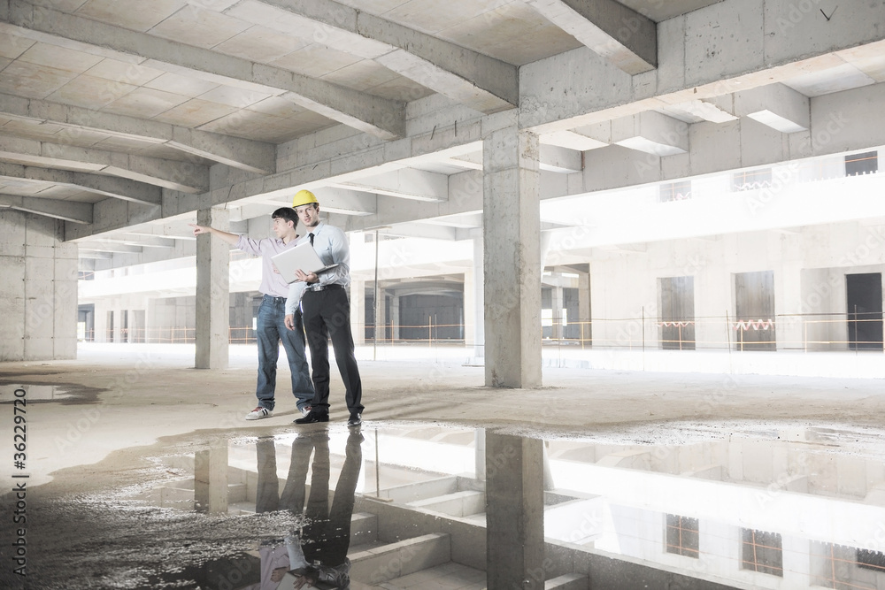 Team of architects on construciton site Team of architects on construciton site