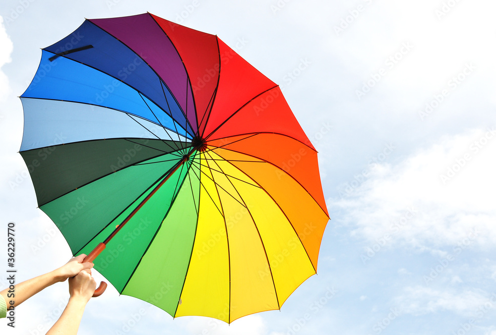 Rainbow umbrella in the hands