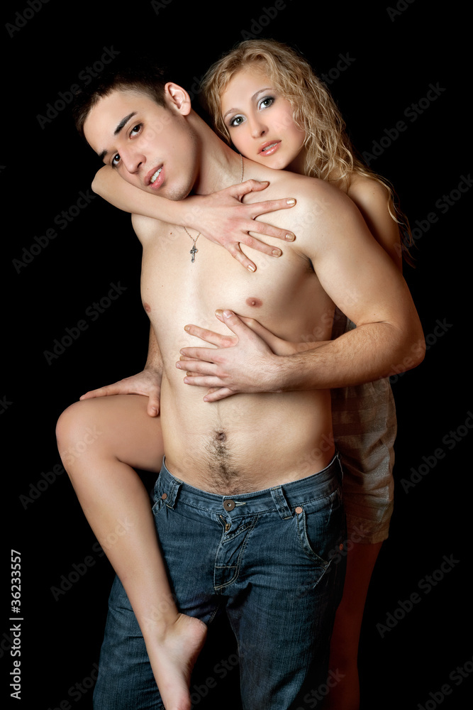Naklejka premium Portrait of beautiful loving young couple. Isolated
