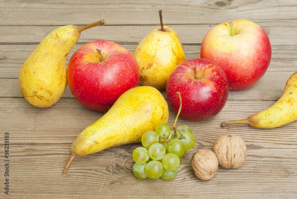 apples grapes and pears, wooden table apples grapes and pears, wooden table