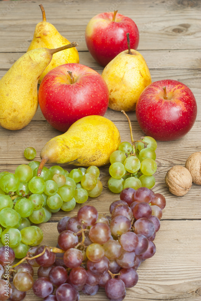 apples grapes and pears, wooden table apples grapes and pears, wooden table
