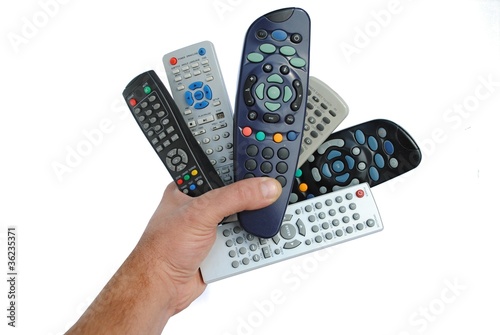 man hand holds six remote control, isolated on white