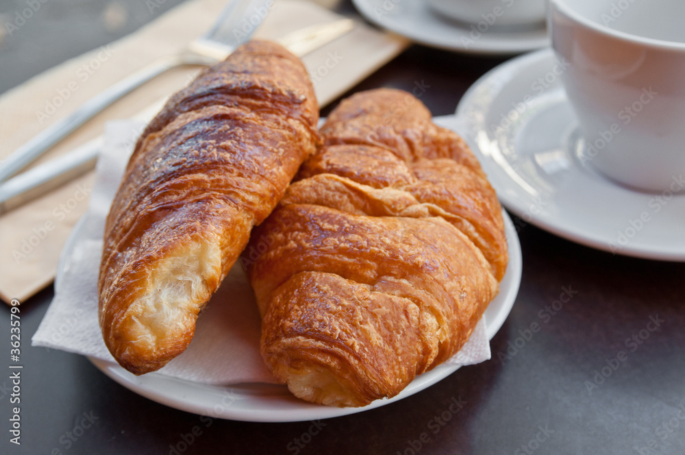 Breakfast with coffee and croissants