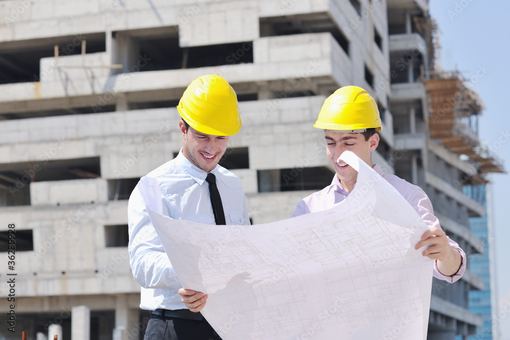 Team of architects on construciton site Team of architects on construciton site