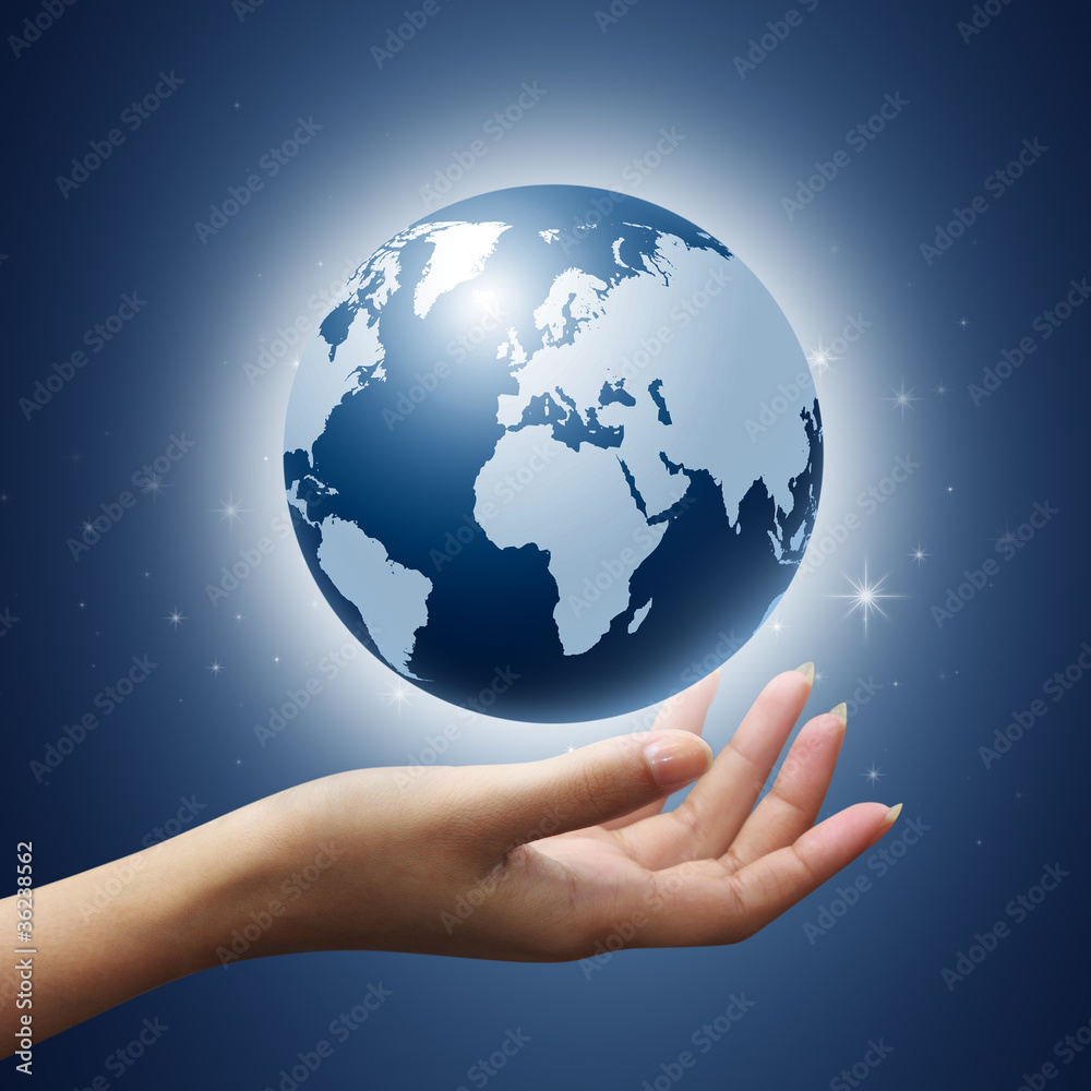 earth globe in woman hands on blue background earth globe in woman hands on blue background