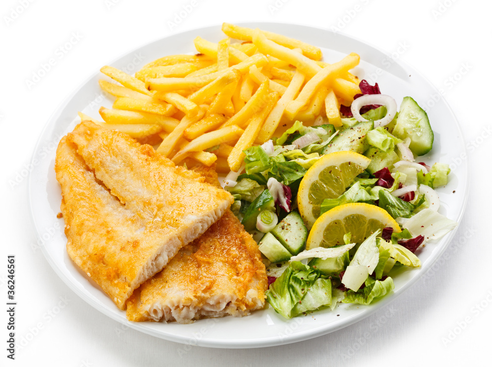 Fish dish - fried fish fillet, French fries with vegetables Fish dish - fried fish fillet, French fries with vegetables