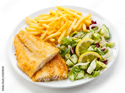 Fish dish - fried fish fillet, French fries with vegetables