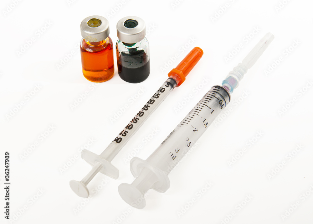 Two syringes and two bottles of medicine Two syringes and two bottles of medicine