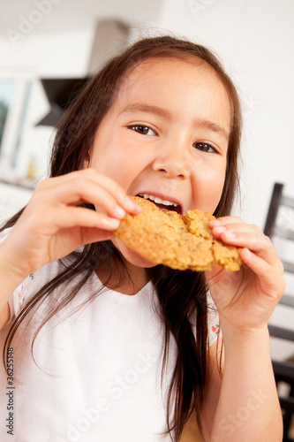 Young Girl Eating Cookie