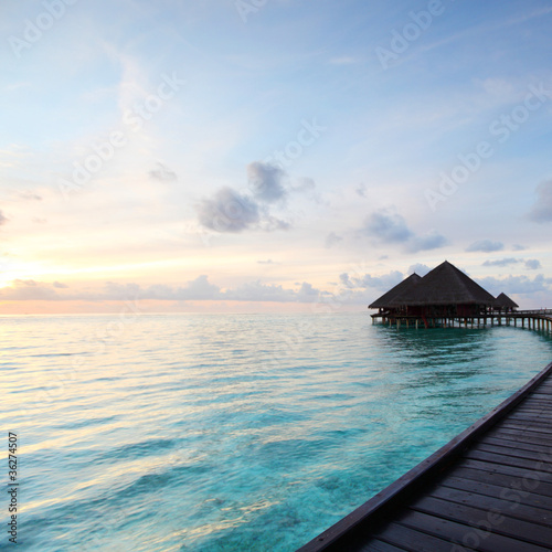 maldivian houses on sunrise