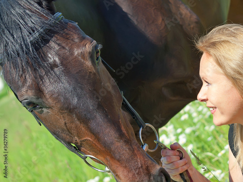 portrait of beautiful women with her mare