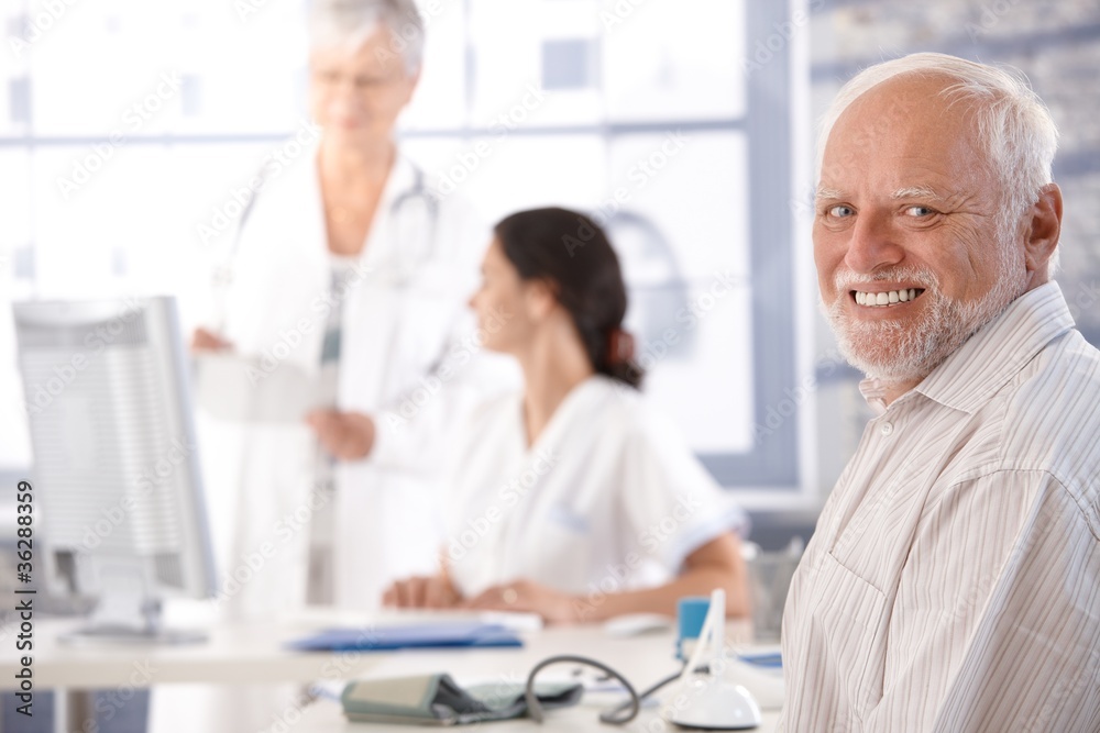 Fototapeta premium Elderly man waiting for examination smiling