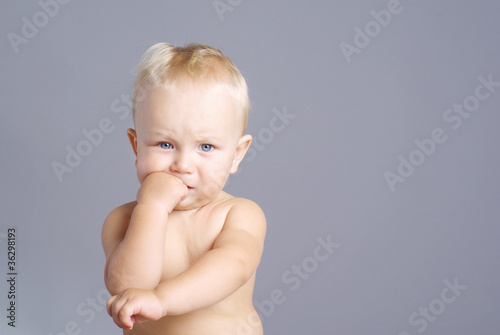 Portrait of cute little boy thinking