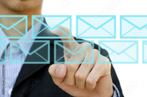 businessman pushing mail for social network on a touch screen