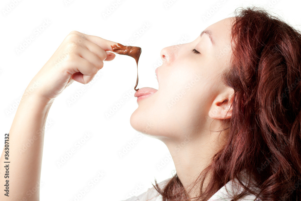 Woman Tasting Chocolate Spread from Her Finger Woman Tasting Chocolate Spread from Her Finger