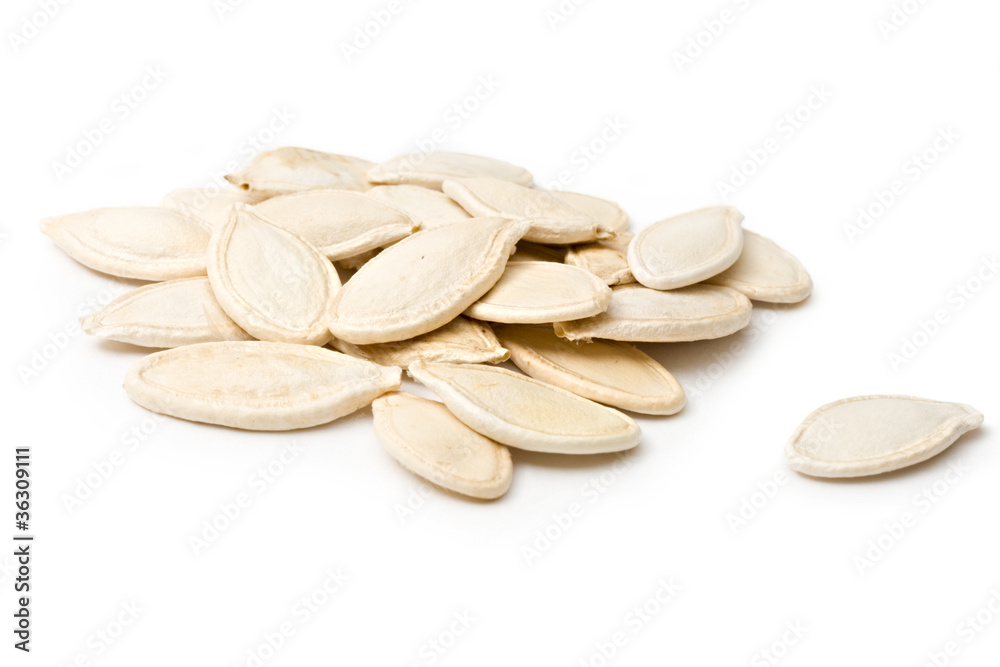 Pumpkin seeds isolated on the white background Pumpkin seeds isolated on the white background