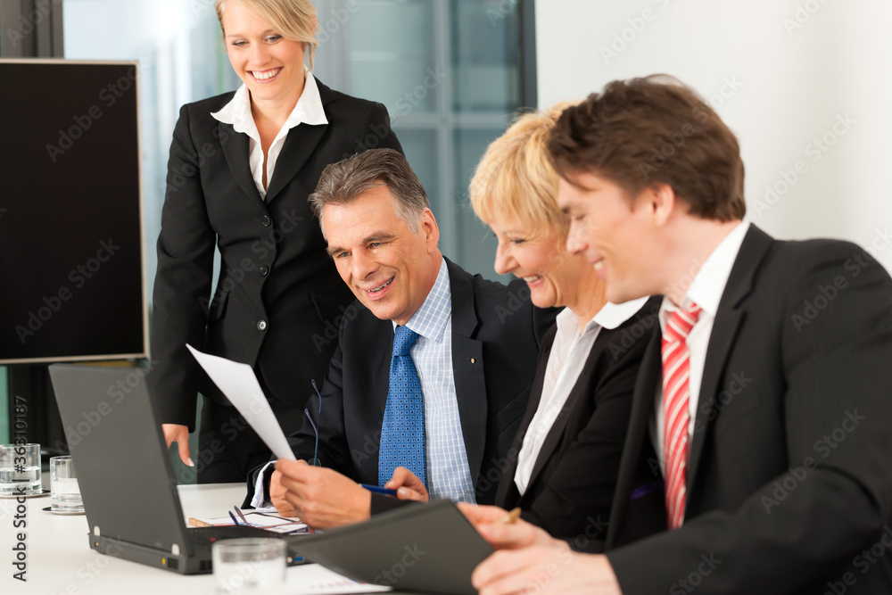 Business - team meeting in an office Business - team meeting in an office