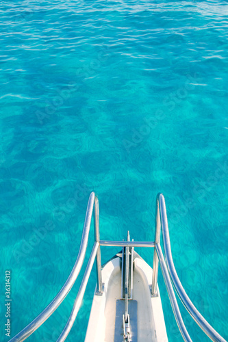 boat bow in transparent turquoise water