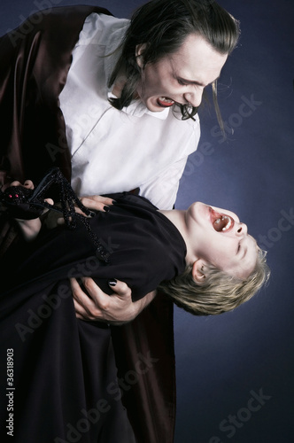 Принти на полотні Adult vampire and his young victim
