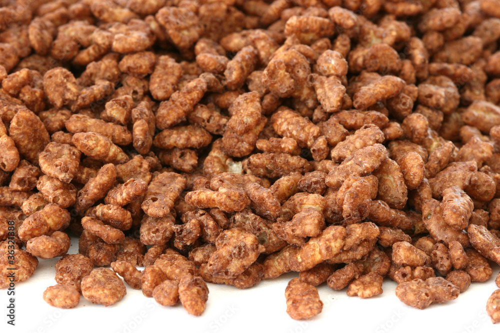 Chocolate popped rice cereals on a white background Chocolate popped rice cereals on a white background