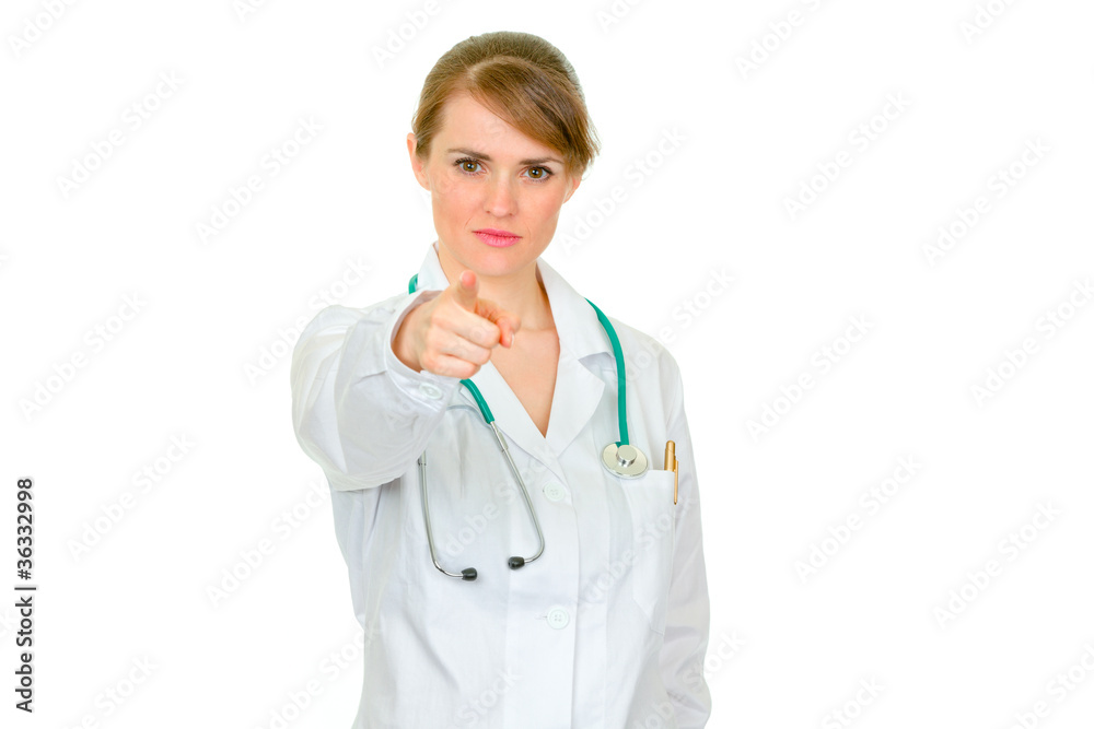 Attractive medical female doctor pointing in camera Attractive medical female doctor pointing in camera