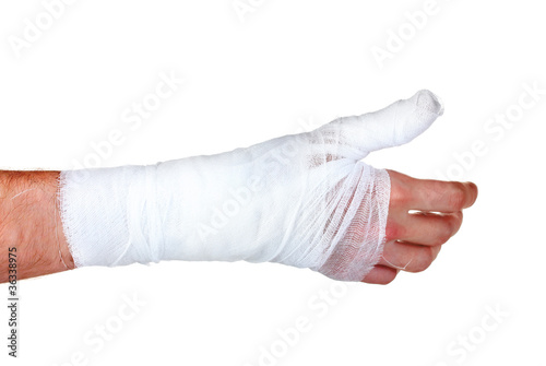 Bandaged hand isolated on white