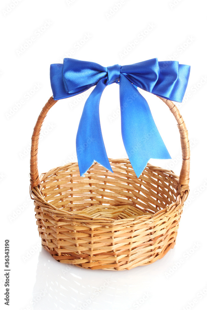 basket with a blue bow isolated on white