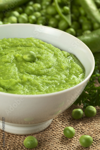 Fresh green pea soup with pea seeds