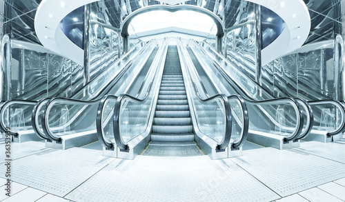 business hall with blue vanishing escalators