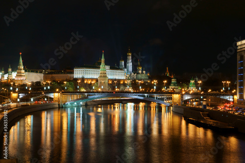 Moscow Kremlin and river under night sky