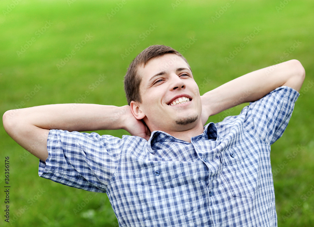 handsome smiling young man enjoying in nature handsome smiling young man enjoying in nature