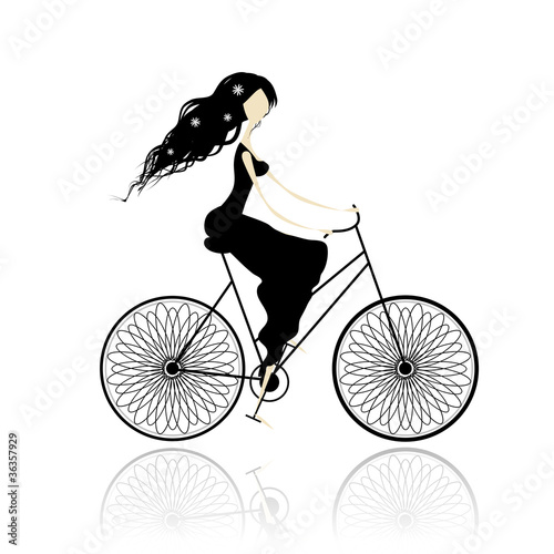 Girl in black dress cycling