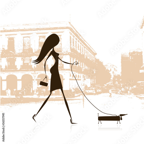 Woman walking with dog on the street