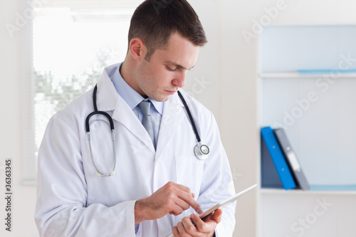 Close up of doctor reading his notes