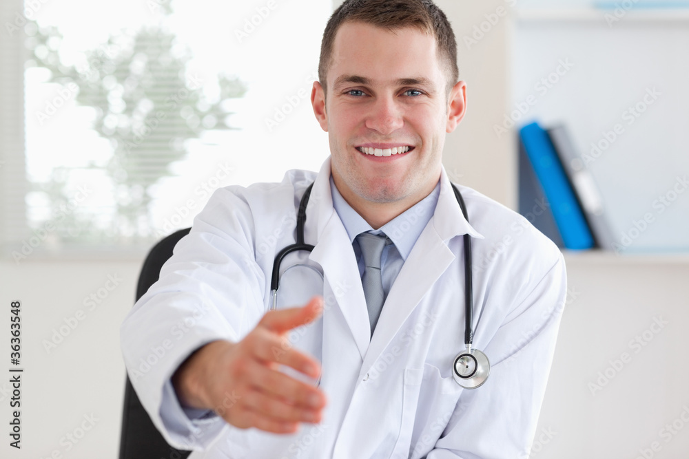 Doctor welcoming patient