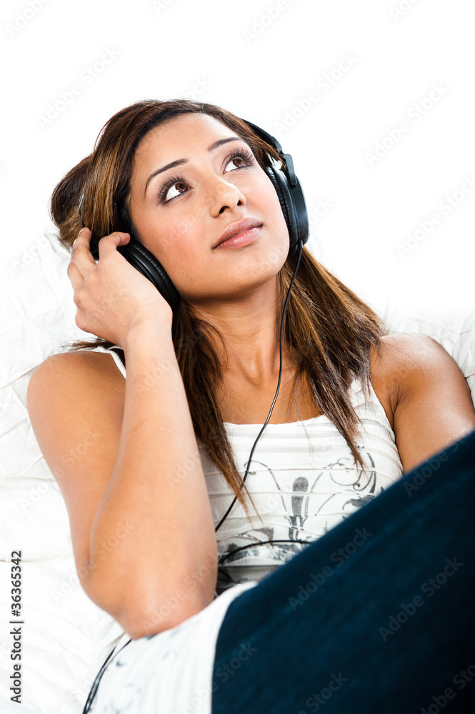 indian teenage girl, with headphones, eyes open
