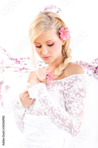 Portrait of a beautiful woman with blossoms, spring